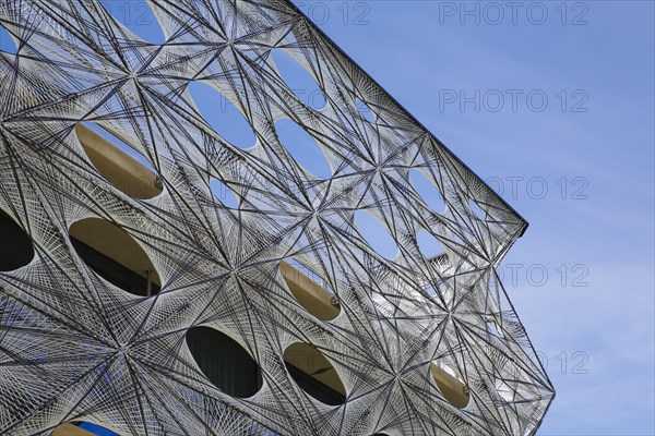 Reutlingen University, Reutlingen University, Texoversum, German University Building Award 2024 for TEXOVERSUM, modern architecture, facade made of carbon and glass fibres, mesh, innovative, identity-creating, unique facade, campus, place of learning, special, extraordinary new building for textile courses, light, airy, airy, holes, detail, architectural eye-catcher, Reutlingen, Baden-Wuerttemberg, Germany, Europe