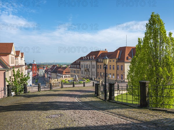 Cobbled street leading from Friedenstein Castle to the historic old town with the main market square and town hall, Gotha, Thuringia, Germany, Europe
