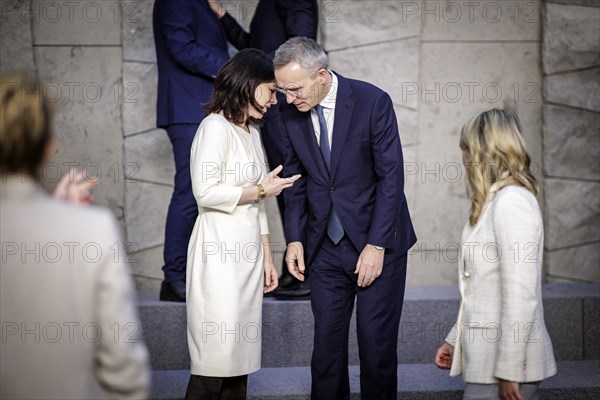 (L-R) Annalena Baerbock, Federal Foreign Minister, in conversation with Jens Stoltenberg, NATO Secretary General, at the family photo during the meeting of NATO foreign ministers. Brussels, 03.04.2024. Photographed on behalf of the Federal Foreign Office