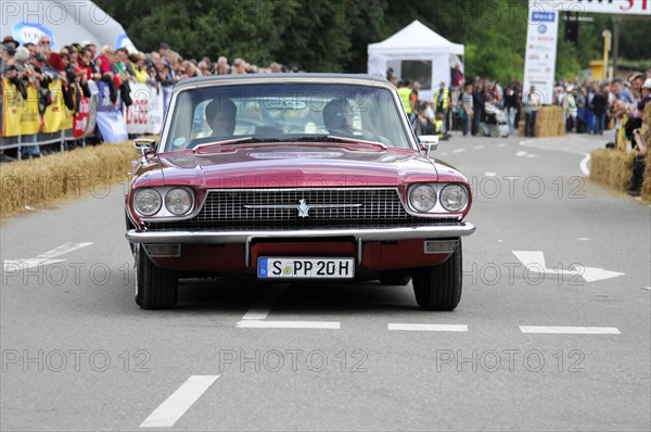 Red convertible vintage car crossing the starting line of a car race, SOLITUDE REVIVAL 2011, Stuttgart, Baden-Wuerttemberg, Germany, Europe