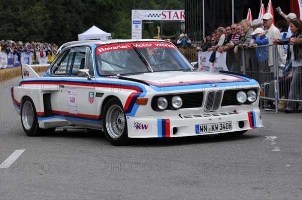 A BMW racing car in classic design on a race track surrounded by fans, SOLITUDE REVIVAL 2011, Stuttgart, Baden-Wuerttemberg, Germany, Europe