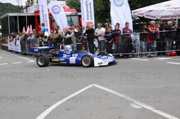 Blue racing car in the foreground with team and advertising banners in the background, SOLITUDE REVIVAL 2011, Stuttgart, Baden-Wuerttemberg, Germany, Europe