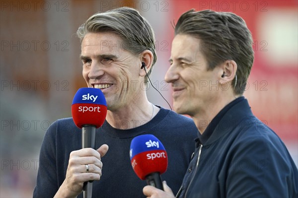 Sports Director Christoph Freund FC Bayern Munich FCB portrait, in interview microphone microphone logo SKY with presenter Michael Leopold SKY, smile, Voith-Arena, Heidenheim, Baden-Wuerttemberg, Germany, Europe