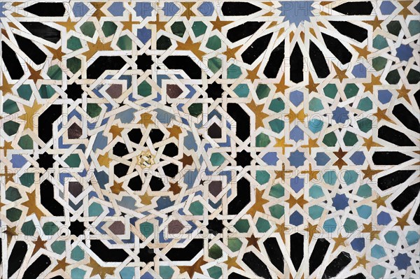 Artistic stone carvings, Alhambra, Granada, wall mosaic with complex geometric pattern in several colours, Granada, Andalusia, Spain, Europe