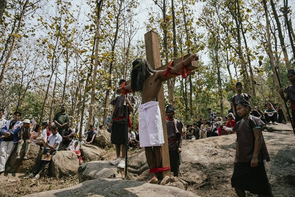 Christian devotees takes part in a perform to re-enactment of the crucifixion of Jesus Christ during a procession on Good Friday, on March 29, 2024 in Guwahati, Assam, India. Good Friday is a Christian holiday commemorating the crucifixion of Jesus Christ and his death at Calvary