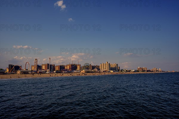 Sun sets on a warm summer day in Coney Island, Brooklyn, NY, USA, USA, North America