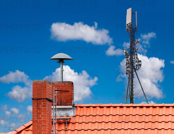 Alarm siren and radio mast on one roof