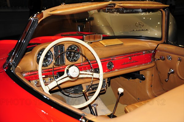 Museum, Mercedes-Benz Museum, Stuttgart, Interior view of a vintage Mercedes with red dashboard and steering wheel, Mercedes-Benz Museum, Stuttgart, Baden-Wuerttemberg, Germany, Europe