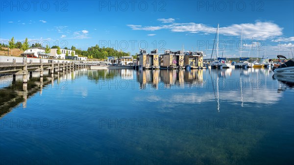 Holiday homes, sailing boats and houseboats in the harbour, Marina Braunsbedra, Geiseltalsee, Saxony-Anhalt, Germany, Europe