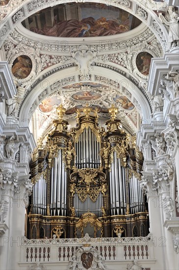 St Stephen's Cathedral, Passau, Magnificent baroque church organ with golden ornamentation under a ceiling painting, St Stephen's Cathedral, Passau, Bavaria, Germany, Europe