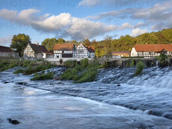 Half-timbered houses on the Weisse Elster river with weir, Wuenschendorf (Elster), Thuringia, Germany, Europe