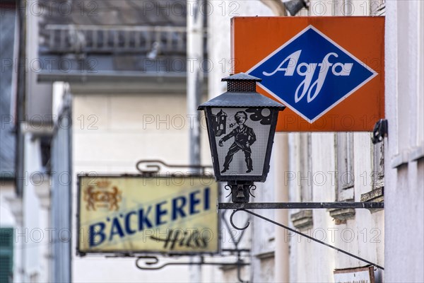 Cantilever sign, AGFA Film und Foto advertising sign, light box, abandoned photo shop, street lamp, dilapidated house, old town, Ortenberg, Vogelsberg, Wetterau, Hesse, Germany, Europe