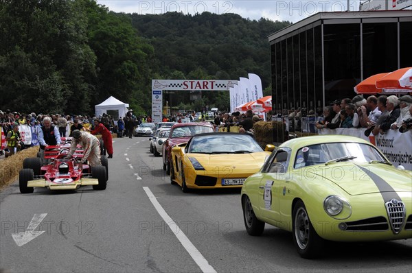 A gathering of sports cars and spectators at a racing event, SOLITUDE REVIVAL 2011, Stuttgart, Baden-Wuerttemberg, Germany, Europe