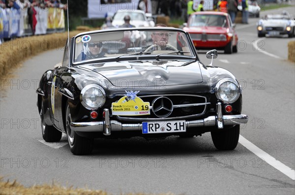 A black Mercedes-Benz 190 SL takes part in a classic car race, SOLITUDE REVIVAL 2011, Stuttgart, Baden-Wuerttemberg, Germany, Europe