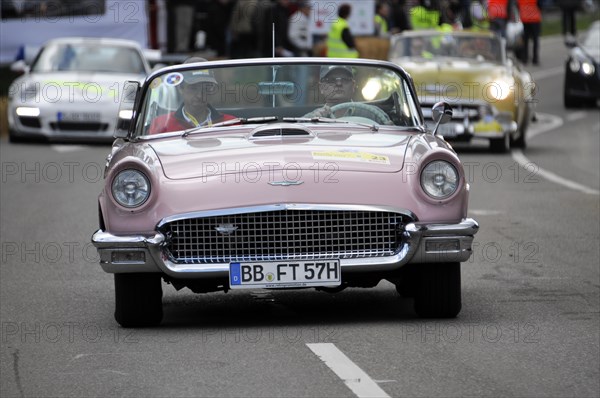 A pink Ford Thunderbird Cabriolet classic car takes part in a road race, SOLITUDE REVIVAL 2011, Stuttgart, Baden-Wuerttemberg, Germany, Europe