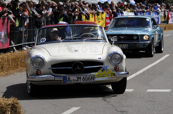 A white Mercedes-Benz vintage cabriolet drives in front of spectators at a road race, SOLITUDE REVIVAL 2011, Stuttgart, Baden-Wuerttemberg, Germany, Europe