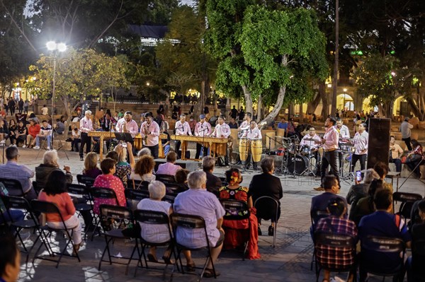 Oaxaca, Mexico, The Marimba del Estado band entertains a crowd in the zocalo. Marimba band music is traditional in southern Mexico, Central America