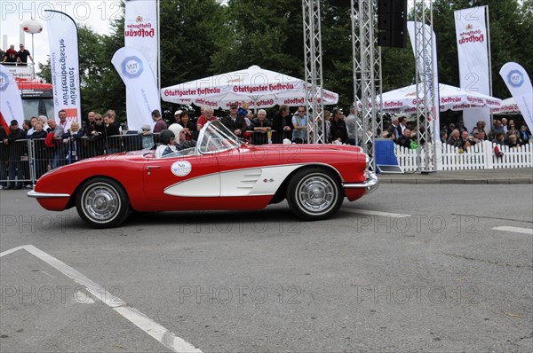 A red vintage sports car drives past spectators as a convertible, SOLITUDE REVIVAL 2011, Stuttgart, Baden-Wuerttemberg, Germany, Europe