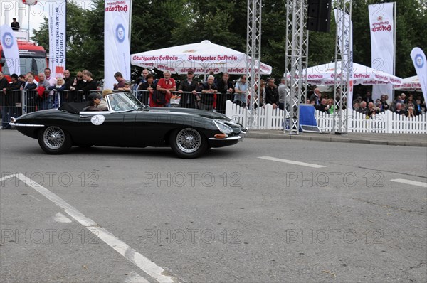 A black Jaguar E-Type classic car on the road with spectators in the background, SOLITUDE REVIVAL 2011, Stuttgart, Baden-Wuerttemberg, Germany, Europe