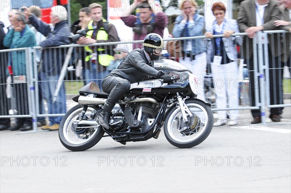 A motorbike racer in action, surrounded by spectators behind barriers, SOLITUDE REVIVAL 2011, Stuttgart, Baden-Wuerttemberg, Germany, Europe
