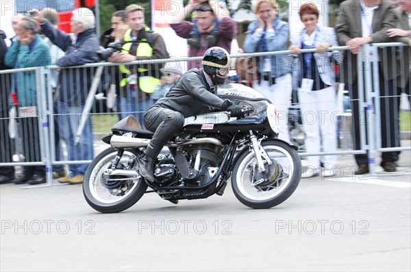 A motorbike racer in action, surrounded by spectators behind barriers, SOLITUDE REVIVAL 2011, Stuttgart, Baden-Wuerttemberg, Germany, Europe