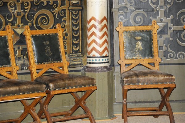 Langenburg Castle, Wooden chairs with leather seats and golden ornaments in a historic interior, Langenburg Castle, Langenburg, Baden-Wuerttemberg, Germany, Europe