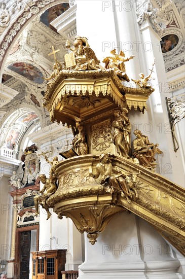 St Stephen's Cathedral, Passau, Golden baroque pulpit with angel sculptures and rich decorations, Passau, Bavaria, Germany, Europe