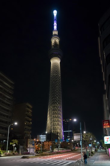 634 meters high Tokyo Skytree, broadcasting and observation tower in Sumida illuminated at night in the city Tokyo, Japan, Asia