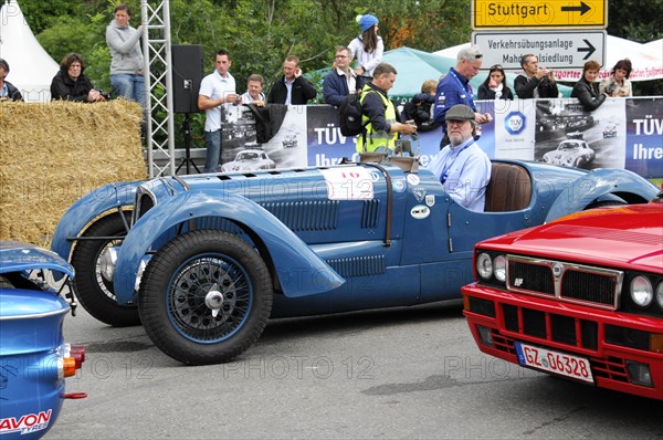 A blue classic racing car is admired by spectators at an event, SOLITUDE REVIVAL 2011, Stuttgart, Baden-Wuerttemberg, Germany, Europe