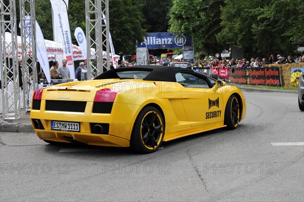 Rear view of a yellow Lamborghini sports car at a car race with spectators in the background, SOLITUDE REVIVAL 2011, Stuttgart, Baden-Wuerttemberg, Germany, Europe