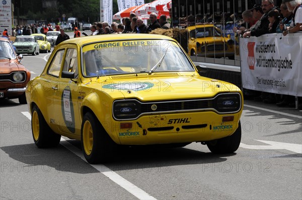 A yellow sports car with rally start number in front of spectators on a race track, SOLITUDE REVIVAL 2011, Stuttgart, Baden-Wuerttemberg, Germany, Europe
