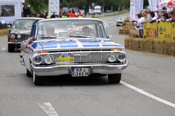 A blue and white Chevrolet classic car at a race with spectators in the background, SOLITUDE REVIVAL 2011, Stuttgart, Baden-Wuerttemberg, Germany, Europe