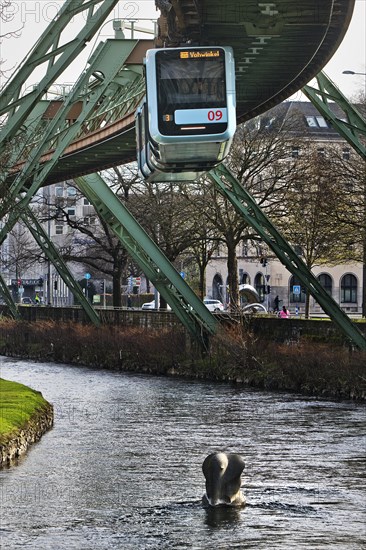 Suspension railway and sculpture by Bernd Bergkemper in the river Wupper commemorating the jump of the elephant Tuffi, Wuppertal, Germany, Europe