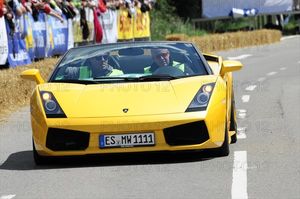 A yellow Lamborghini drives on a race track in front of spectators, SOLITUDE REVIVAL 2011, Stuttgart, Baden-Wuerttemberg, Germany, Europe
