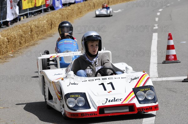 A racing driver in a white miniature racing car takes part in a race, SOLITUDE REVIVAL 2011, Stuttgart, Baden-Wuerttemberg, Germany, Europe