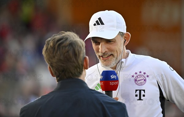 Coach Thomas Tuchel FC Bayern Munich FCB portrait, in interview microphone, SKY, with presenter Michael Leopold, SKY, Adidas, Deutsche Telekom, Logo, Voith-Arena, Heidenheim, Baden-Wuerttemberg, Germany, Europe