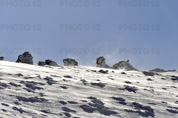Mountains in Andalusia, Mountain range with snow, near Pico del Veleta, 3392m, Gueejar-Sierra, Sierra Nevada National Park, Snow-covered rocks rise under a bright blue sky in a winter landscape, Costa del Sol, Andalusia, Spain, Europe