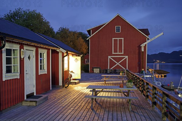 Wooden jetty with cosy wooden houses and benches, Rorbuer, holiday, fishing, Halsa, Kystriksveien, FV 17, Norway, Europe