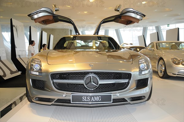 Museum, Mercedes-Benz Museum, Stuttgart, A silver Mercedes-Benz SLS AMG with open gullwing doors in a showroom, Mercedes-Benz Museum, Stuttgart, Baden-Wuerttemberg, Germany, Europe