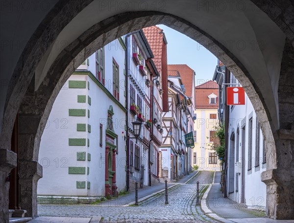 Archway at the town hall in the historic old town, alley with cobblestones, Muehlhausen, Thuringia, Germany, Europe