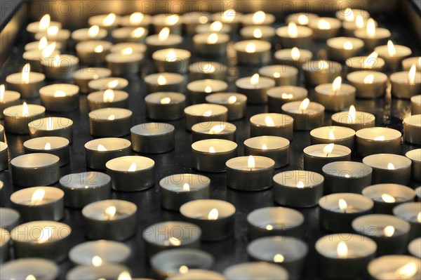 Speyer Cathedral, Many lit candles next to each other, radiating peace and contemplation, Speyer Cathedral, Unesco World Heritage Site, Foundation stone laid around 1030, Speyer, Rhineland-Palatinate, Germany, Europe