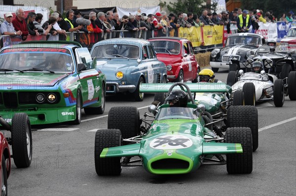 A green formula car on a race track surrounded by spectators, SOLITUDE REVIVAL 2011, Stuttgart, Baden-Wuerttemberg, Germany, Europe