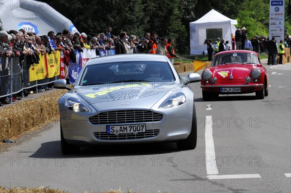 Silver Aston Martin leads a red Alfa Romeo in a classic car race, SOLITUDE REVIVAL 2011, Stuttgart, Baden-Wuerttemberg, Germany, Europe