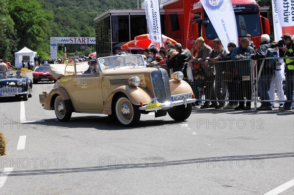 Gold-coloured classic car at a rally with spectators in the background, SOLITUDE REVIVAL 2011, Stuttgart, Baden-Wuerttemberg, Germany, Europe