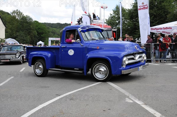 Blue Ford vintage pickup truck at an event with spectators at the roadside, SOLITUDE REVIVAL 2011, Stuttgart, Baden-Wuerttemberg, Germany, Europe