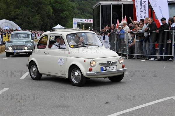 A small white vintage car drives on a road at an event, SOLITUDE REVIVAL 2011, Stuttgart, Baden-Wuerttemberg, Germany, Europe