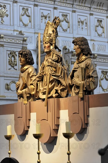 The Neumuenster collegiate monastery, diocese of Wuerzburg, Kardinal-Doepfner-Platz, detailed view of a sculptural group of saints in baroque clothing on a church altar, Wuerzburg, Lower Franconia, Bavaria, Germany, Europe