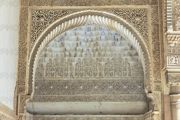 Artistic stone carvings, Alhambra, Granada, detail of a stucco decoration above an arch in historical Arabic architecture, Granada, Andalusia, Spain, Europe