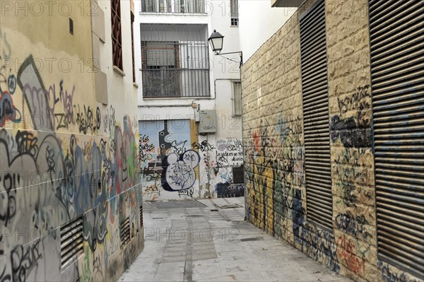 Jaen, Destroyed graffiti and murals covered with tags and messages on an urban street, Jaen, Andalusia, Spain, Europe