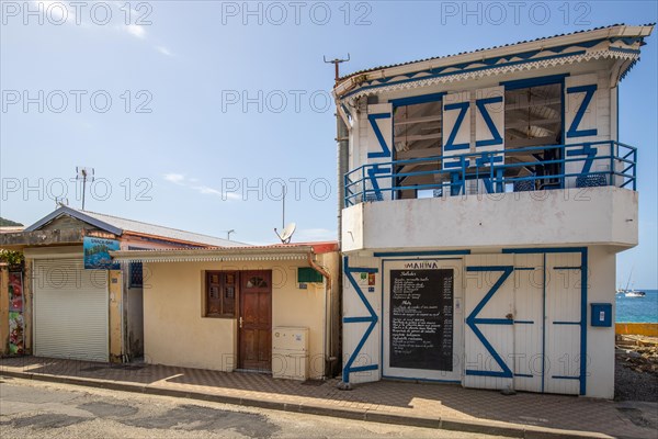 Deshaies, historic Caribbean wooden building of a street in Guadeloupe, Caribbean, French Antilles